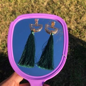 Gold dangling earrings with green tassels on them!